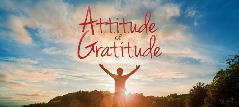 Silhouette of a person with arms raised against a colorful sunset, featuring the text "Attitude of Gratitude."